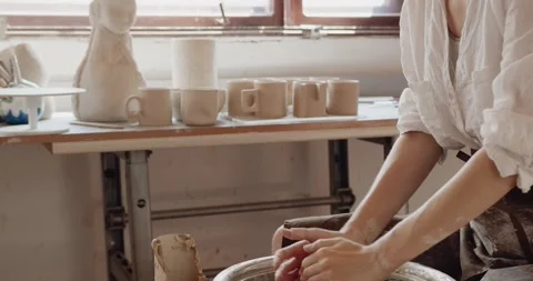 Craftswoman hands work with earthenware. Art studio production and craftsmanship Stock Footage 218430596