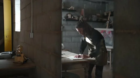 Craftswoman making sketch in workshop Stock Footage 167422555