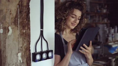 Craftswoman with tablet computer in art studio Stock Footage 161797201