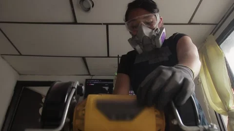 Craftswoman using a yellow machine Stock Footage 232030486