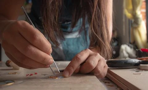Craftswoman working on her table Stock-Fotos