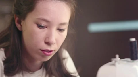 Craftswoman in the workshop selects threads for fabric Stock Footage 269807527