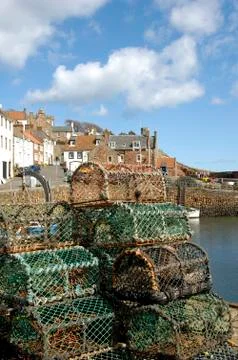 Crail harbour and lobster pots Stock Photos