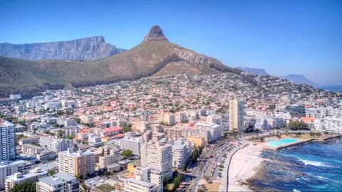 A crain view of Sea point with Table Mountain, Lions Head and blue sea. Stock Photos
