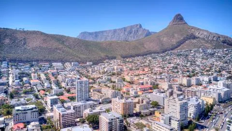A crain view of Sea point with Table Mountain, Lions Head and blue sea. Stock Photos
