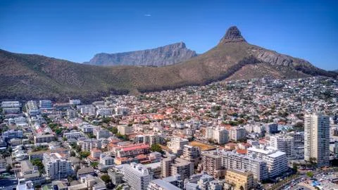 A crain view of Sea point with Table Mountain, Lions Head and blue sea. Stock Photos