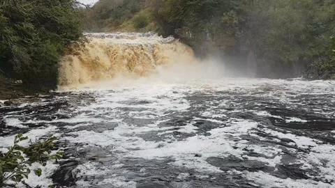 Crammel Linn waterfall in full flow, Cumbria/Northumberland border, UK Stock Footage