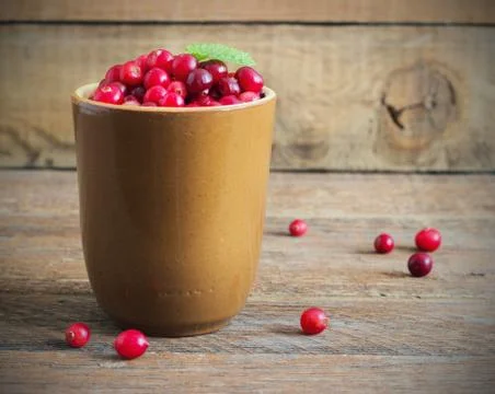 Cranberries in a ceramic mug Stock Photos