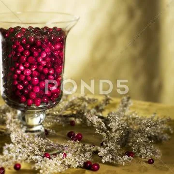 Cranberries In Hurricane Vase As Christmas Decoration