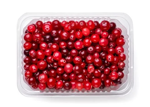 Cranberries in a plastic box on a white background. Top view Foto stock