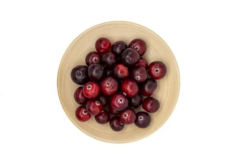 Cranberries on a plate isolate on a white background top view Stock Photos