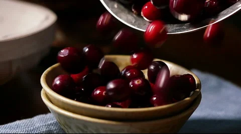 Cranberries pouring into dish, slow motion Stock Footage 45051287