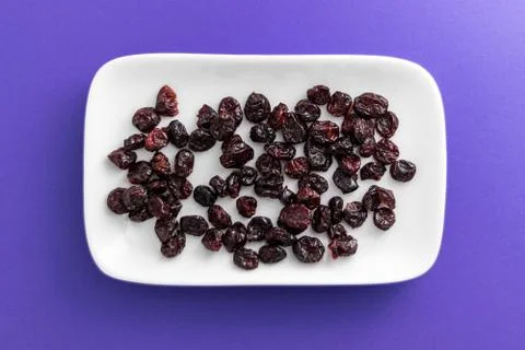 Cranberries on a white plate Stock Photos