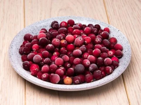 Cranberries in a wicker tray Stock Photos
