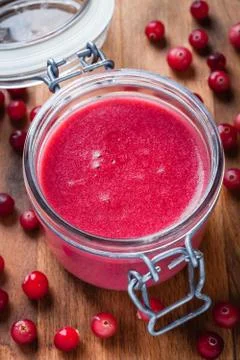 Cranberry curd in a glass jar Stock Photos