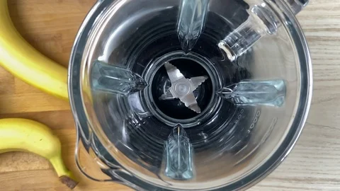 Cranberry falling down into blender, close-up, super slow motion Stock Footage 125997544