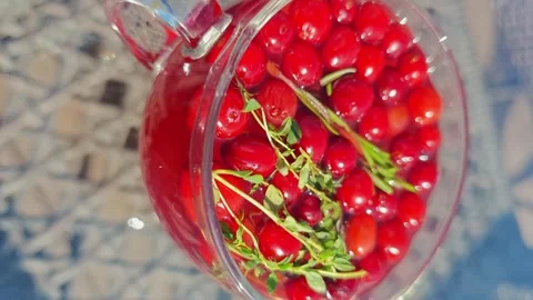 Cranberry ginger tea preparation during afternoon at home Stock Footage 341410102