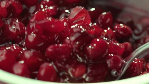 Cranberry jam is mixed with a spoon Stock Footage 121701799