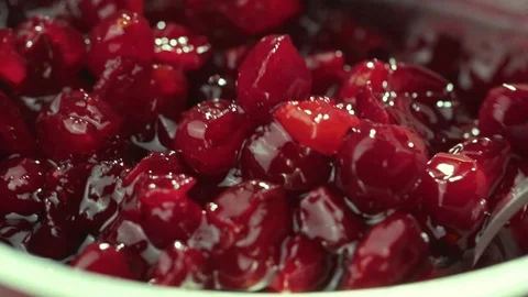 Cranberry jam is mixed with a spoon Stock Footage 121701802