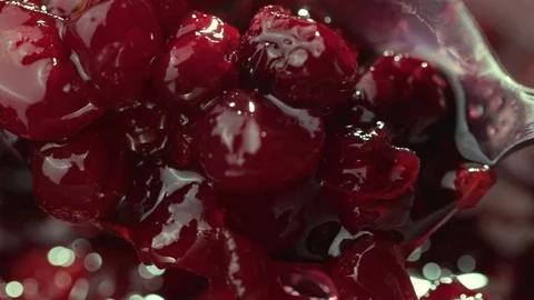 Cranberry jam is mixed with a spoon Stock Footage 121701811