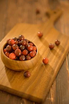 Cranberry recipe on wooden kitchen table. Brown natural background Stock-Fotos