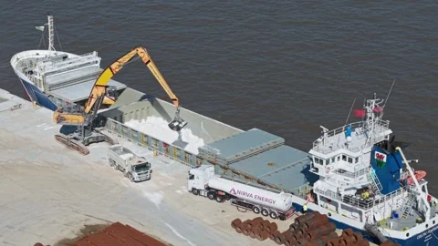 Crane and bucket unloading from cargo ship onto lorry, Wirral, England Stock Footage 305104820