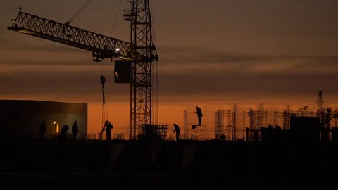 Crane and builders are building a skyscraper on the sky background Stock Footage 99623904