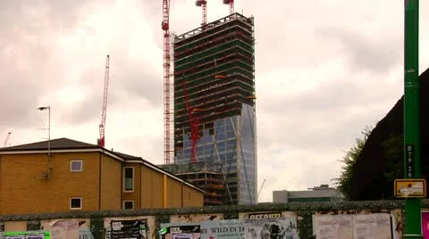 Crane and building construction site against grey sky Stock Footage 22151814