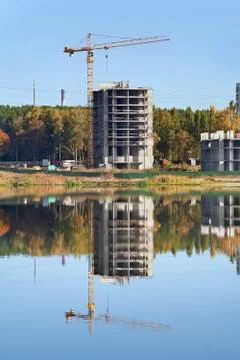 Crane and building reflection Stock Photos