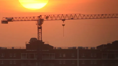 Crane and building at sunset time Stock Footage 125336142