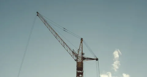 Crane and building under construction against blue sky Stock Footage 138246538