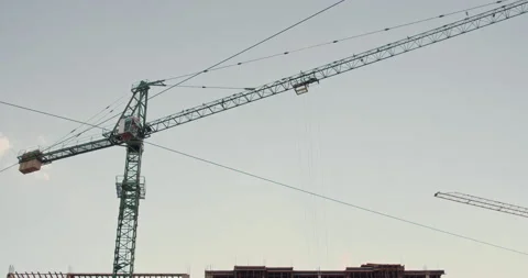 Crane and building under construction against blue sky Stock Footage 138858843
