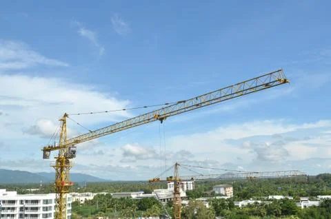 Crane and building working progress, construction site Stock Photos