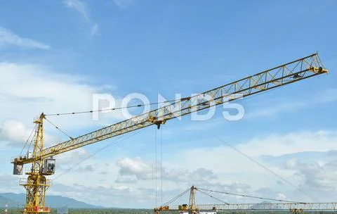 Crane and building working progress, construction site Stock Photos