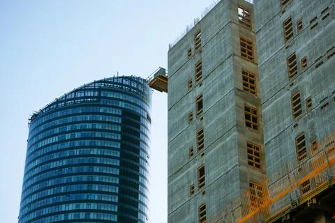 Crane and construction structures. Construction of a new office center Stock Photos