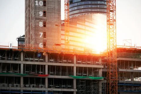 Crane and construction structures. Construction of a new office center Stock Photos