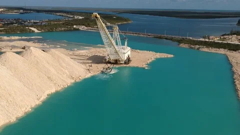 Crane and Heavy Machinery Working at Fishing Hole Road, Bahamas Aerial Stock Footage 89655076