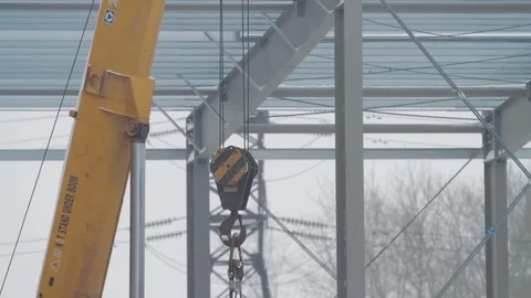 Crane and hook. Hook a crane yellow color. Building crane boom with steel hook Stock Footage 126268535