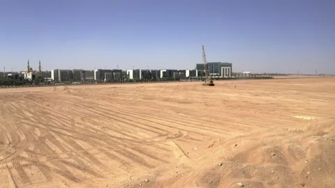 Crane and prepared ground in front of a row of Riyadh offices 库存影片 346429563