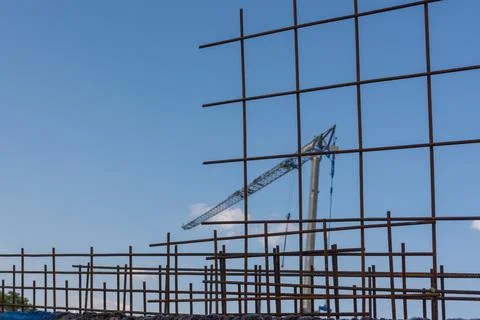 Crane and scaffoldings in a construction process Stock Photos