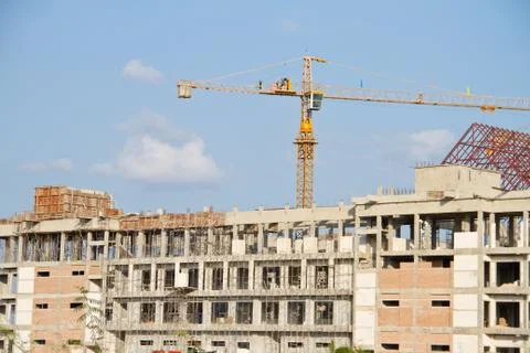 Crane and workers at construction Stock Photos
