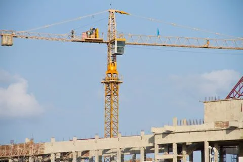 Crane and workers at construction Stock Photos