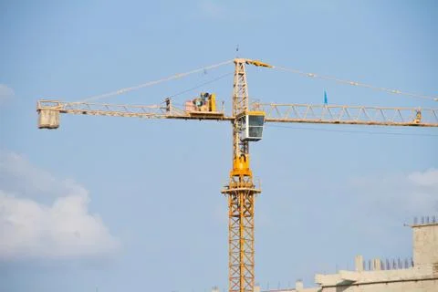 Crane and workers at construction Stock Photos