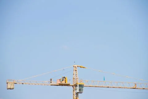 Crane and workers at construction Stock Photos