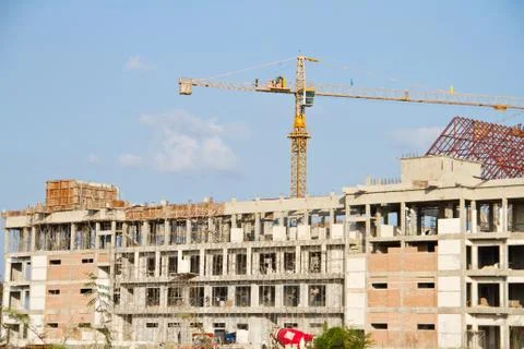 Crane and workers at construction Stock Photos