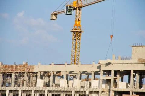 Crane and workers at construction Stock Photos