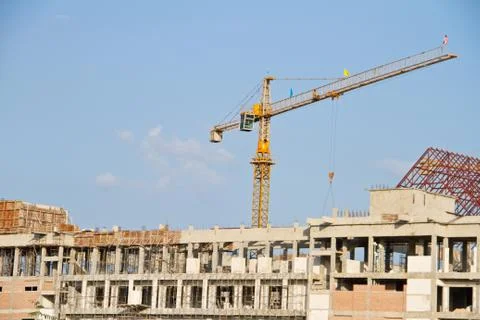 Crane and workers at construction Stock Photos