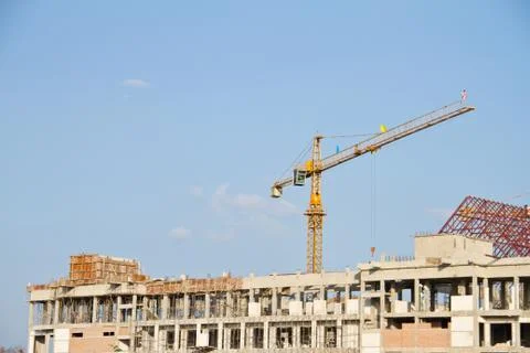 Crane and workers at construction Stock Photos
