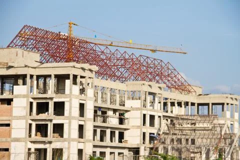 Crane and workers at construction Stock Photos