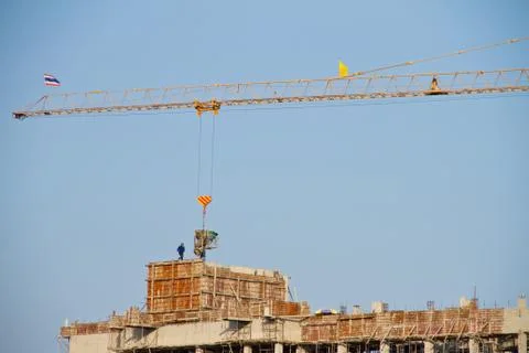 Crane and workers at construction Stock Photos